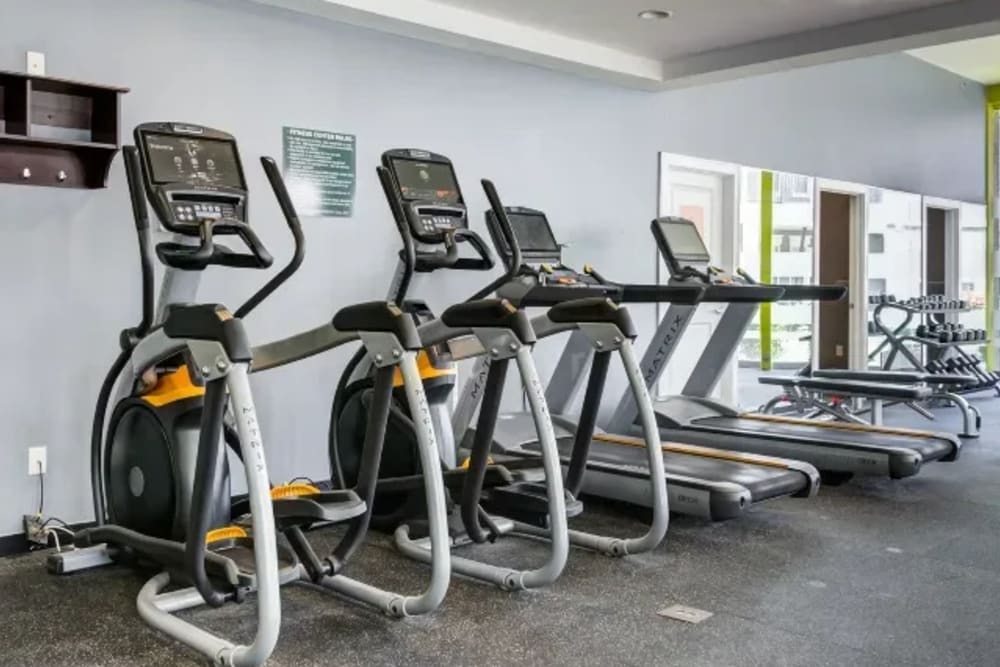 Community gym with treadmills and ellipticals at The Landing at St. Louis in Saint Louis, Missouri