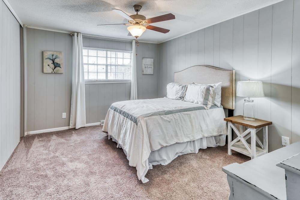 Model apartment bedroom with a desk and a twin bed at Patriot's Place Townhomes in Goose Creek, South Carolina