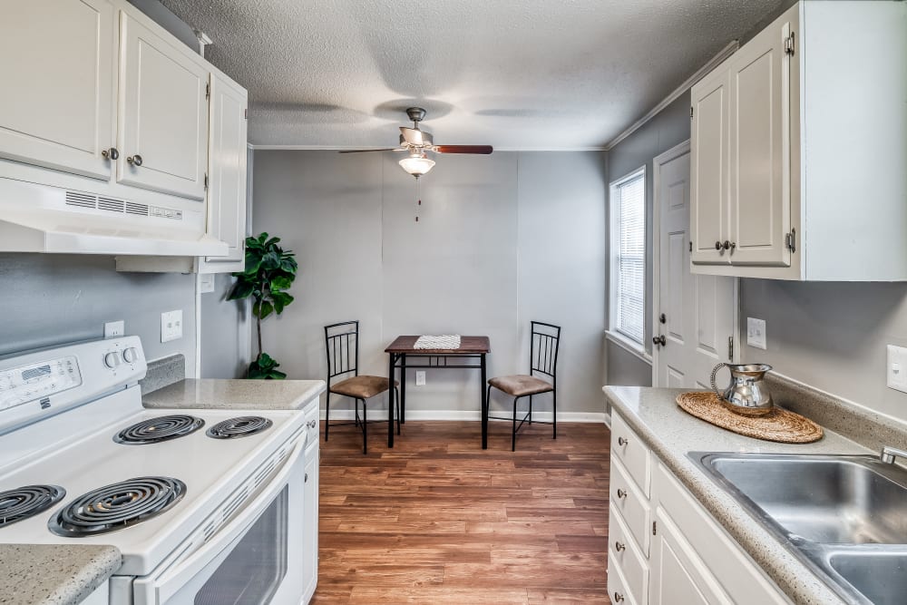 Apartment dining room with a door leading outside at Patriot's Place Townhomes in Goose Creek, South Carolina