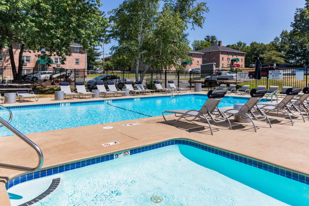 Our Beautiful Apartments in Nashua, New Hampshire showcase a Swimming Pool