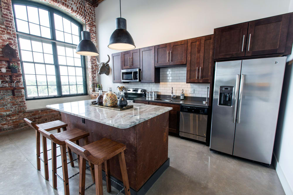 Spacious kitchen in a model home at West Village Lofts at Brandon Mill in Greenville, South Carolina