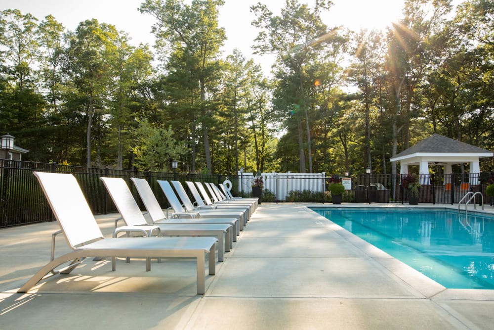 Resident gated pool showcasing the waiting area at Highcroft Apartment Homes in Simsbury, Connecticut