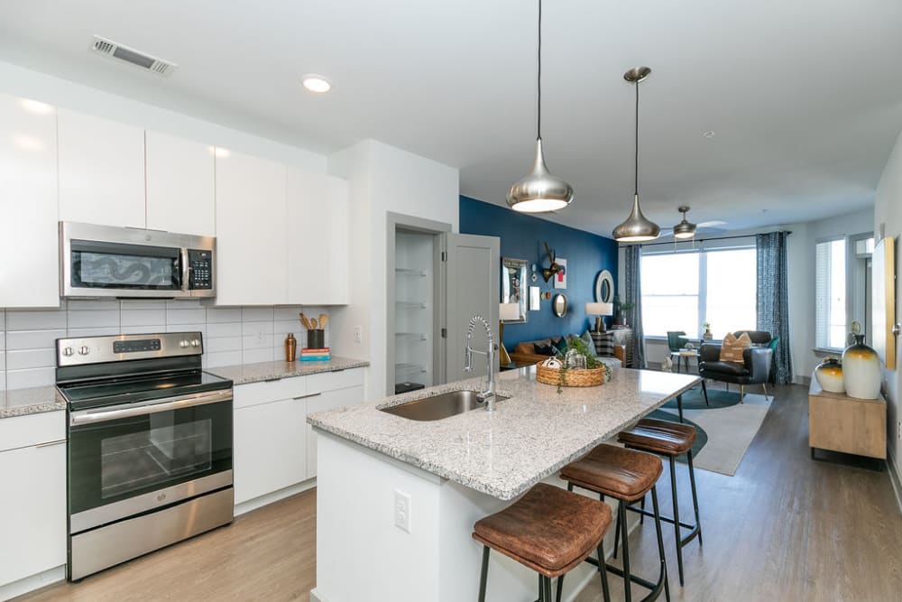Stylish kitchen with island seating at EDGE on the Beltline | Apartments in Atlanta, Georgia