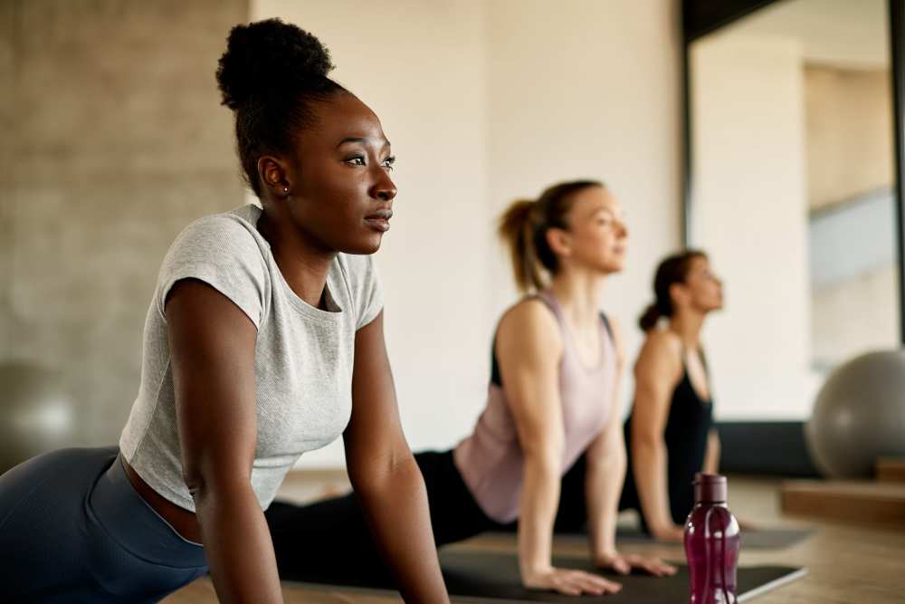 Resident doing yoga at The Maggie Flats in Jacksonville, Florida