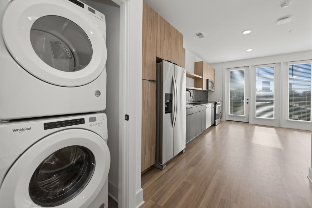 Stacked, full-size washer and dryer in a modern apartment home at The Scottie in Nashville, Tennessee