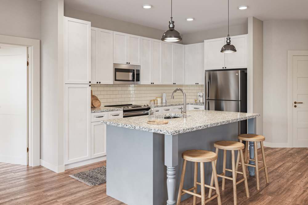 Kitchen with island and bar stools at Lake Forest at Swift Creek in Midlothian, Virginia