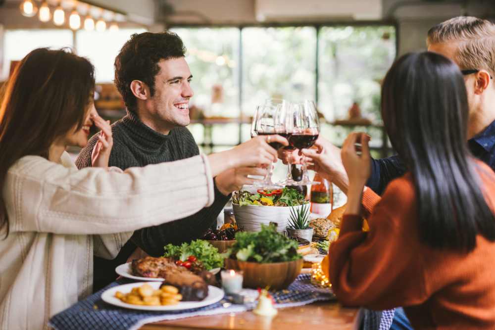 Group of residents dining together near 2001 Clarendon BLVD in Arlington, Virginia