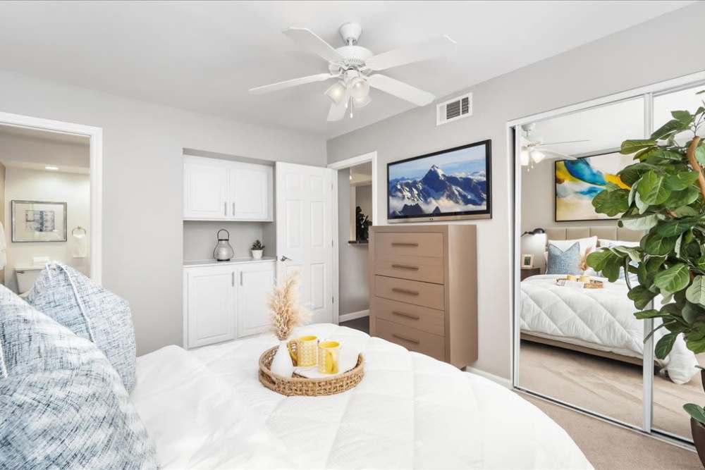Bedroom with ceiling fan at Mirabella Apartments in Bermuda Dunes, California