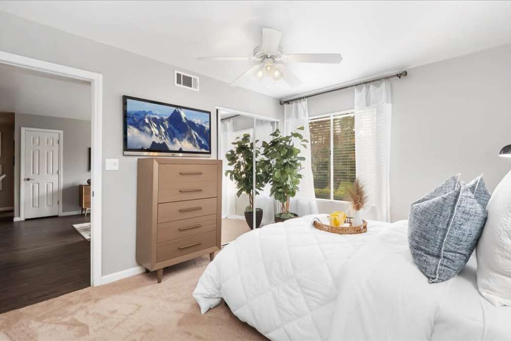 Bedroom in model home at  Mirabella Apartments in Bermuda Dunes, California