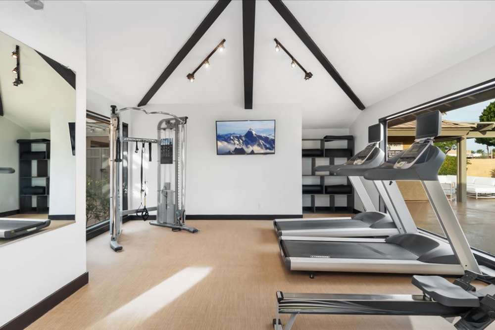 Fitness center with large windows at Mirabella Apartments in Bermuda Dunes, California