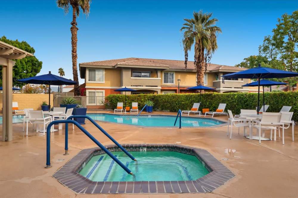 Spa and pool with palm trees at Mirabella Apartments in Bermuda Dunes, California