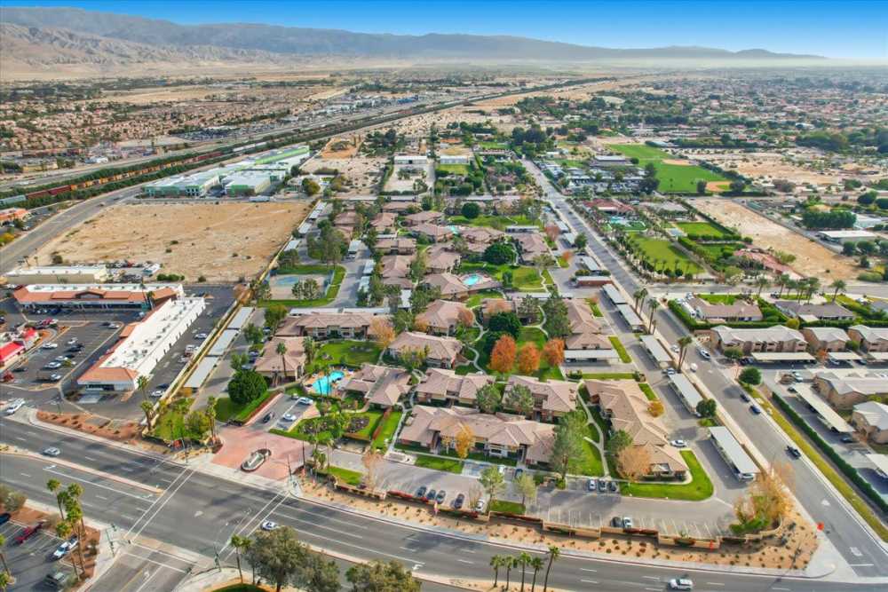Aerial view of property and nearby mountains at  Mirabella Apartments in Bermuda Dunes, California