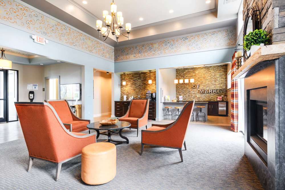 Resident lounge with orage chairs at East of Market in Frederick, Maryland