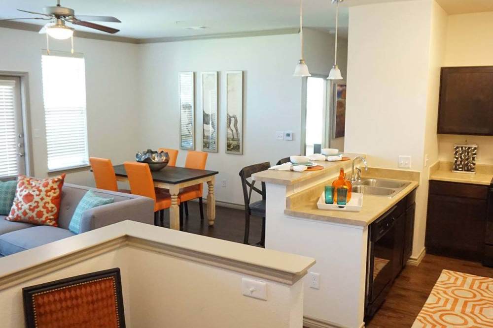 Apartment kitchen and living area at Latigo Crossing in Victoria, Texas