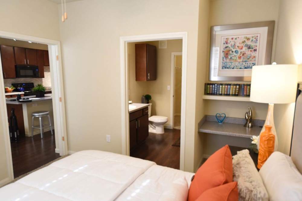 Apartment bedroom with an bathroom at Oak Forest in Victoria, Texas