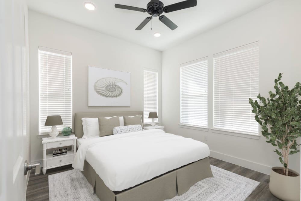 Spacious bedroom with large windows at Elevate at Skyline in McKinney, Texas