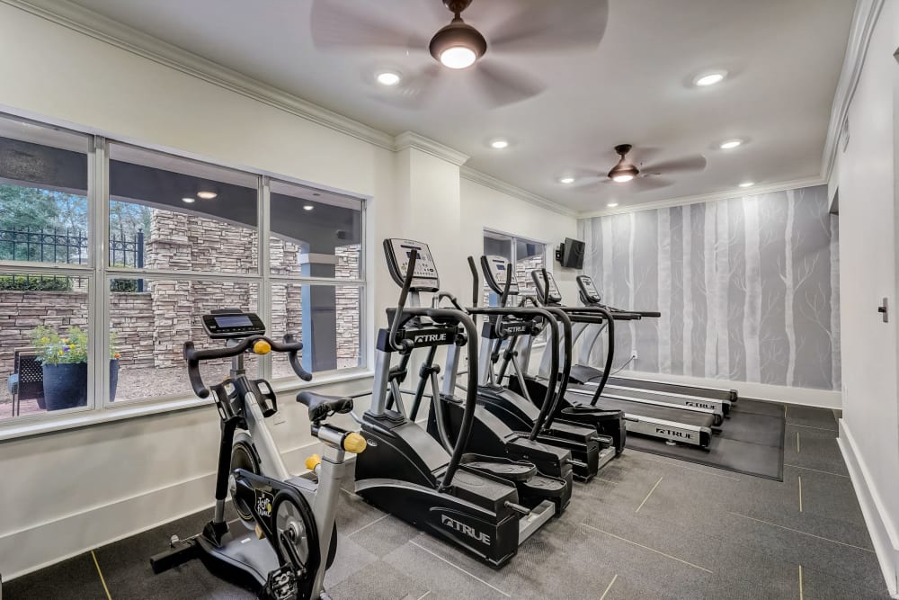 A row of treadmills and stair machines in the fitness center at Aster Buckhead in Atlanta, Georgia