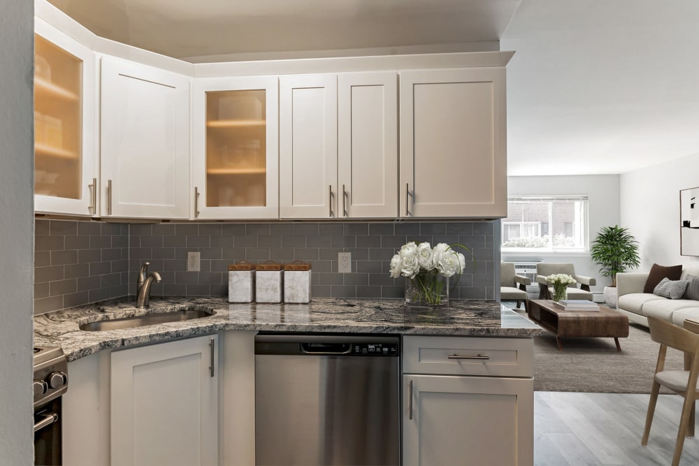 Modern kitchen with hanging cabinet at Mid Island Apartments Bay Shore, New York