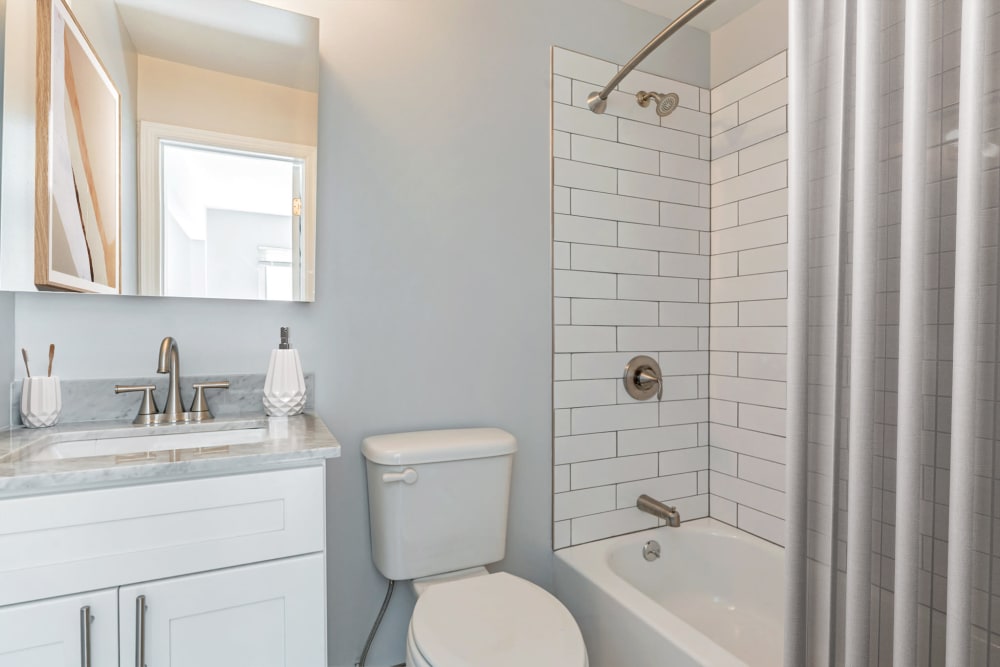 White beautiful bathroom at Mid Island Apartments Bay Shore, New York