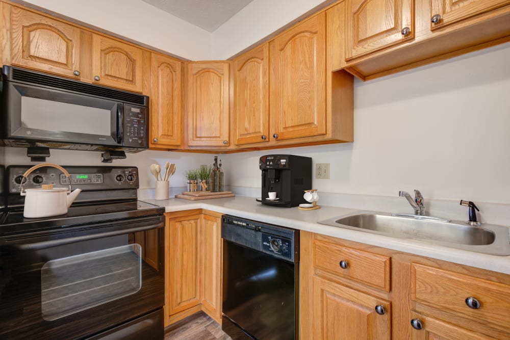 Fully equipped kitchen in a home at Brighton Colony Townhomes in Rochester, New York
