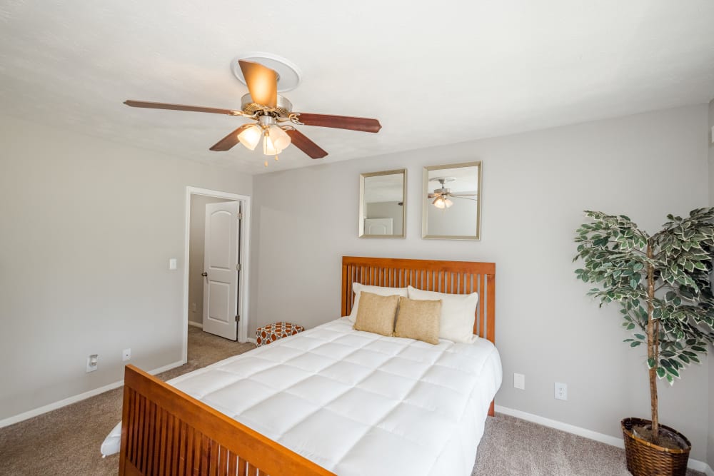 A twin-sized bed in a model apartment bedroom at LaVista Crossing in Tucker, Georgia