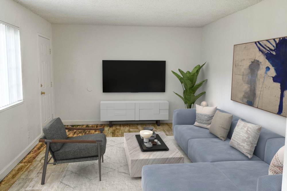 Living room with  Tv and furniture at Cherry Creek Apartments in San Jose, CA