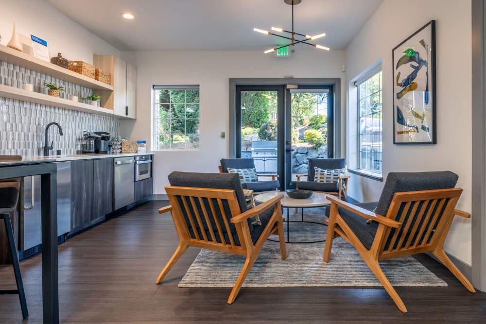 Clubhouse kitchen with chairs and a table at 1202 Pearl in Tacoma, Washington