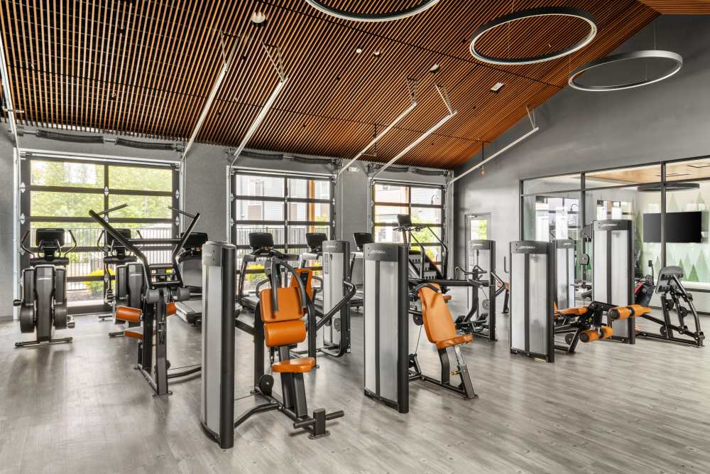 Fitness center with lots of machines at 207 East in Edgewood, Washington