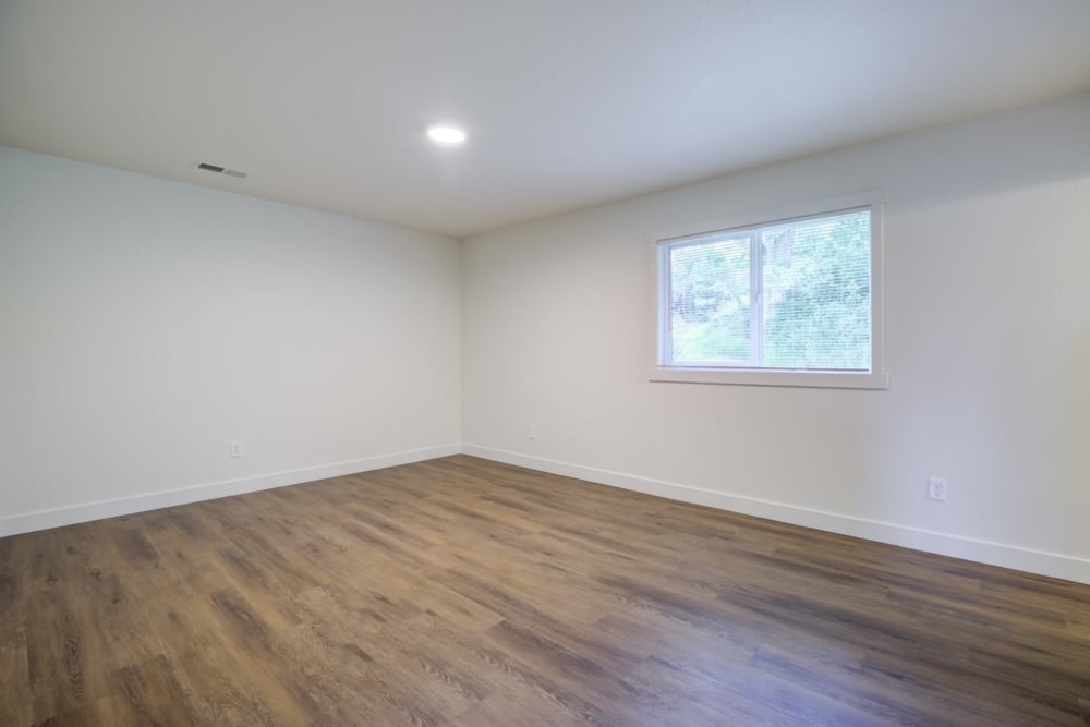 Large bedroom with LVP floorping at Davis Hill in Joint Base Lewis McChord, Washington
