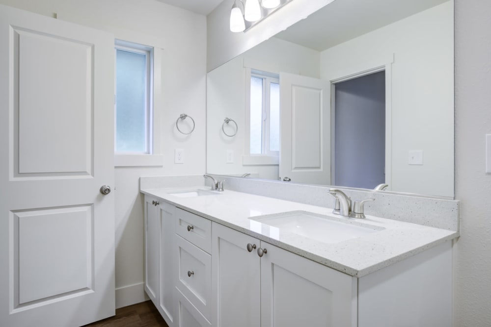 Updated bathroom with double sink vanity at Davis Hill in Joint Base Lewis McChord, Washington