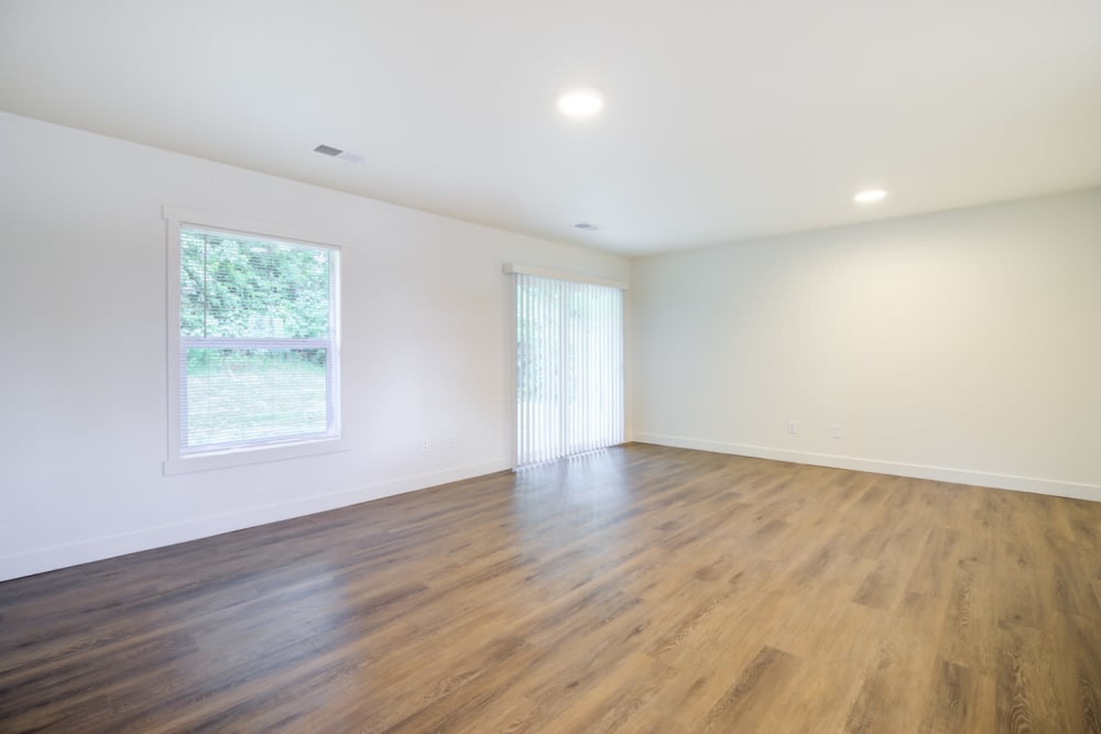 Large livingroom with LVP flooring at Davis Hill in Joint Base Lewis McChord, Washington