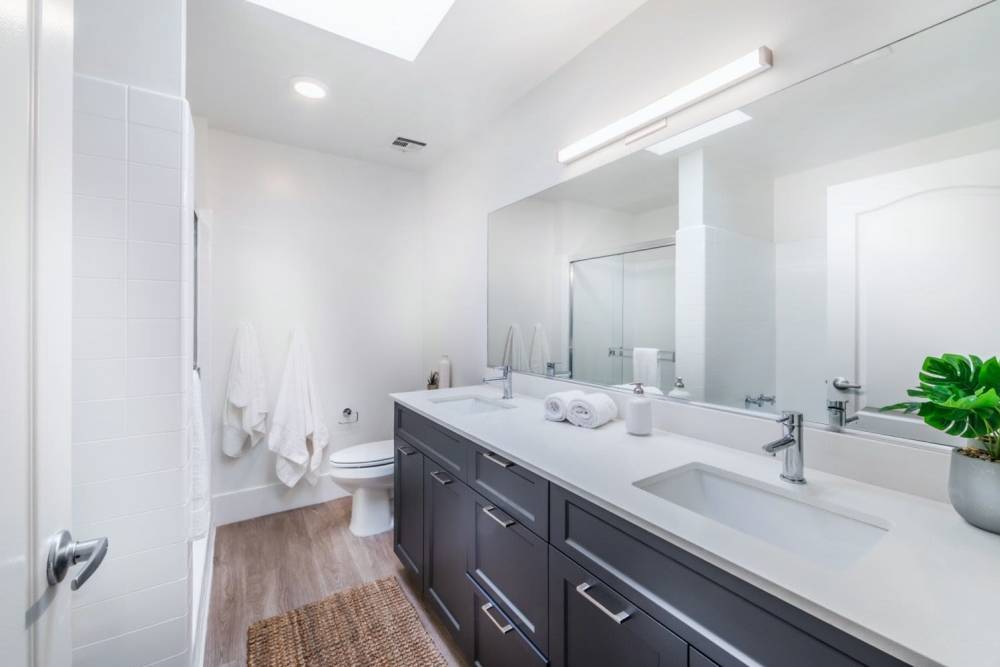 Large bathroom with cabinetry at 1900 Ocean Apartment Homes in Long Beach,California
