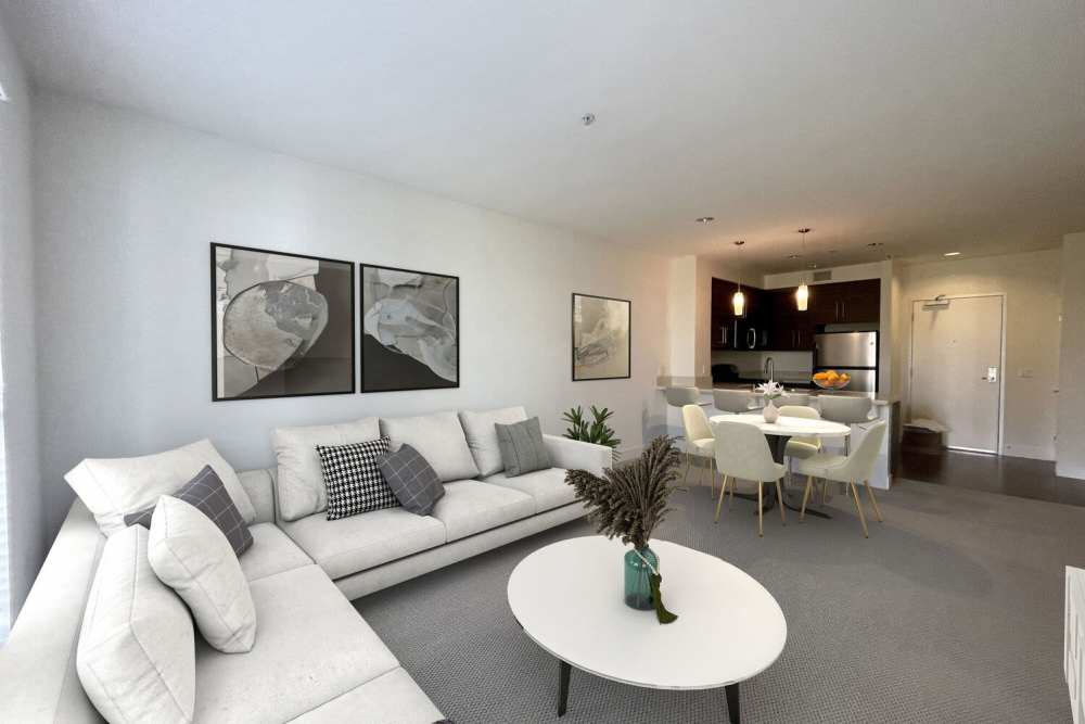 Living room with a couch and a coffee table at The Marke Apartment Homes in Santa Ana,