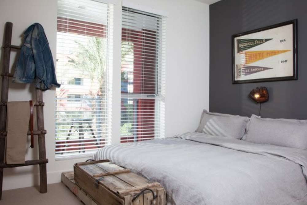 Cozy bedroom at The Marke Apartment Homes in Santa Ana,
