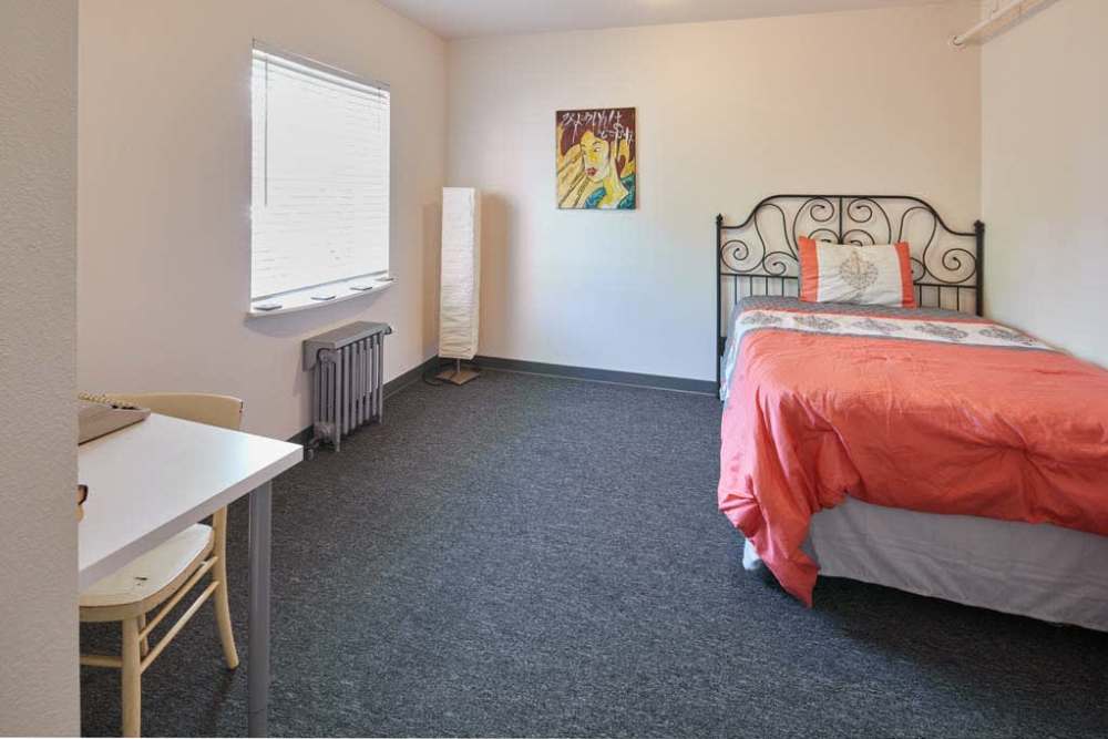 Well-lit bedroom with soft carpet at Milepost 5 in Portland, Oregon 