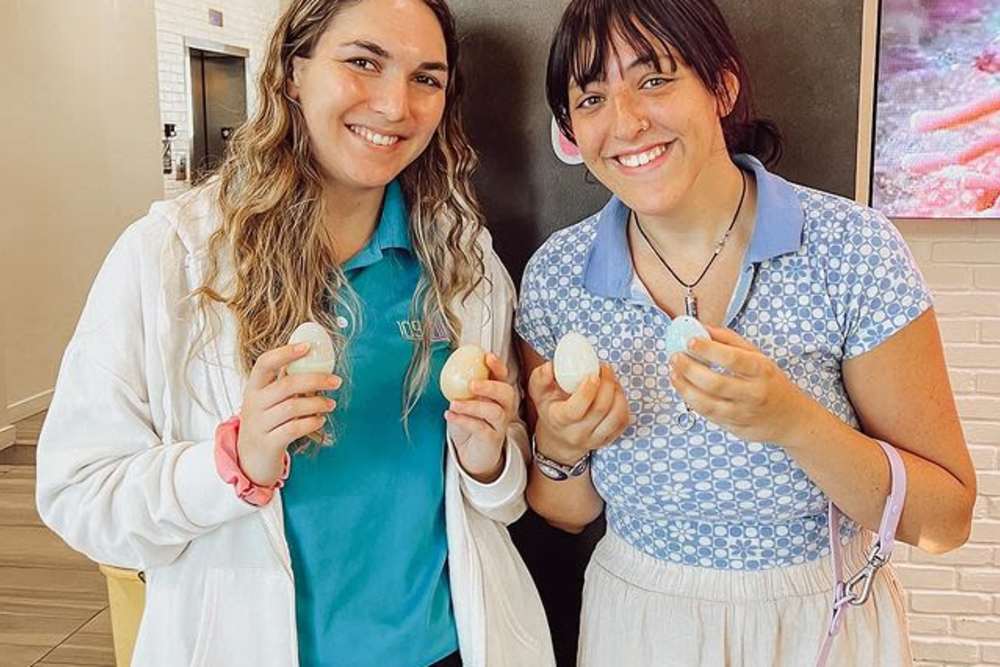 Staff posing with Easter eggs at 109 Tower in Miami, Florida