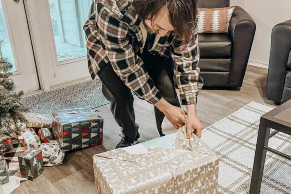 Resident opening a present at The Quarters at Lawrence in Lawrence, Kansas