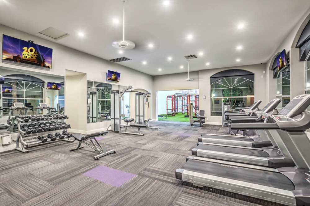 Fitness center with treadmill at Calypso Apartments in Las Vegas, Nevada