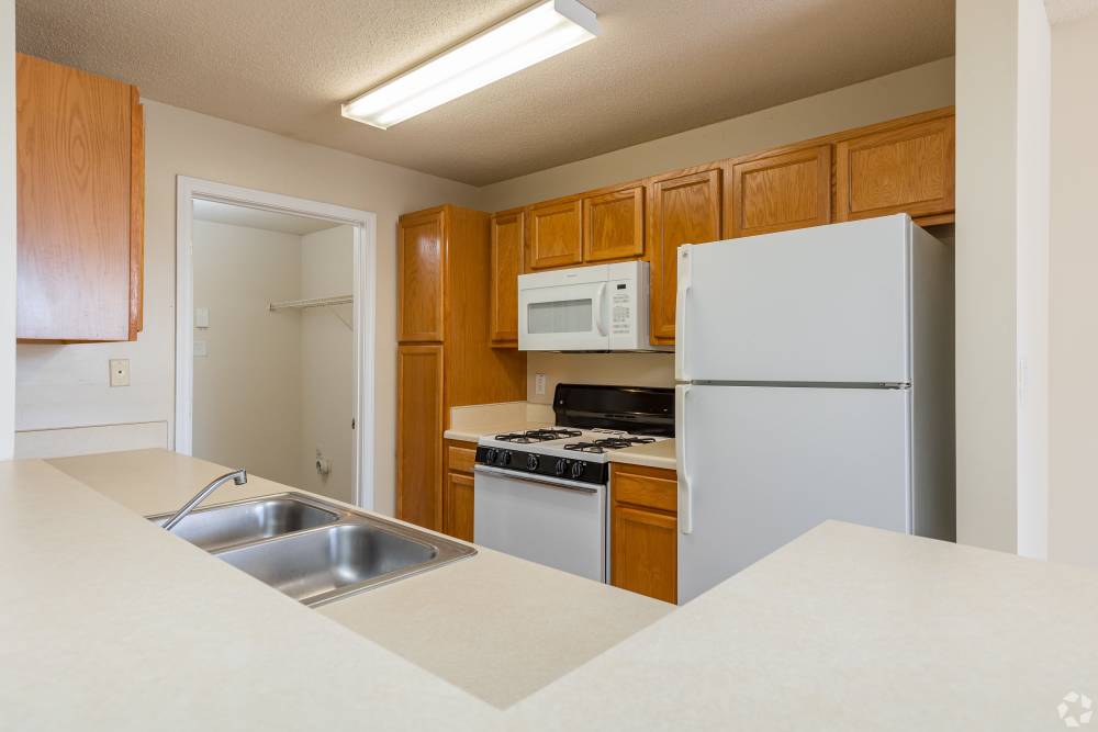 Kitchen with modern equipment at Cherokee Summit Apartments in Acworth, Georgia