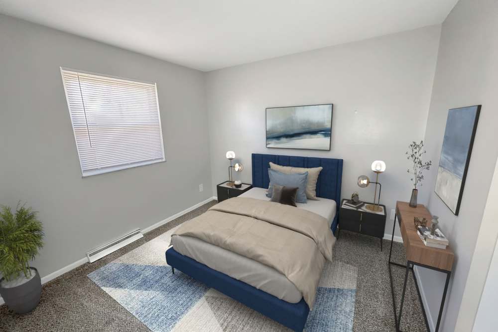 Bright bedroom with comfortable bed at Eden Brooke Townhomes in Columbus, Ohio