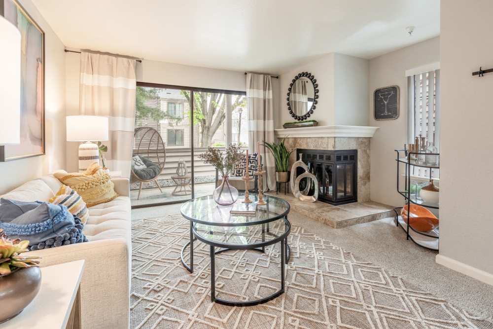 Living room with fireplace at Hidden Lake Condominium Rentals in Sacramento, California