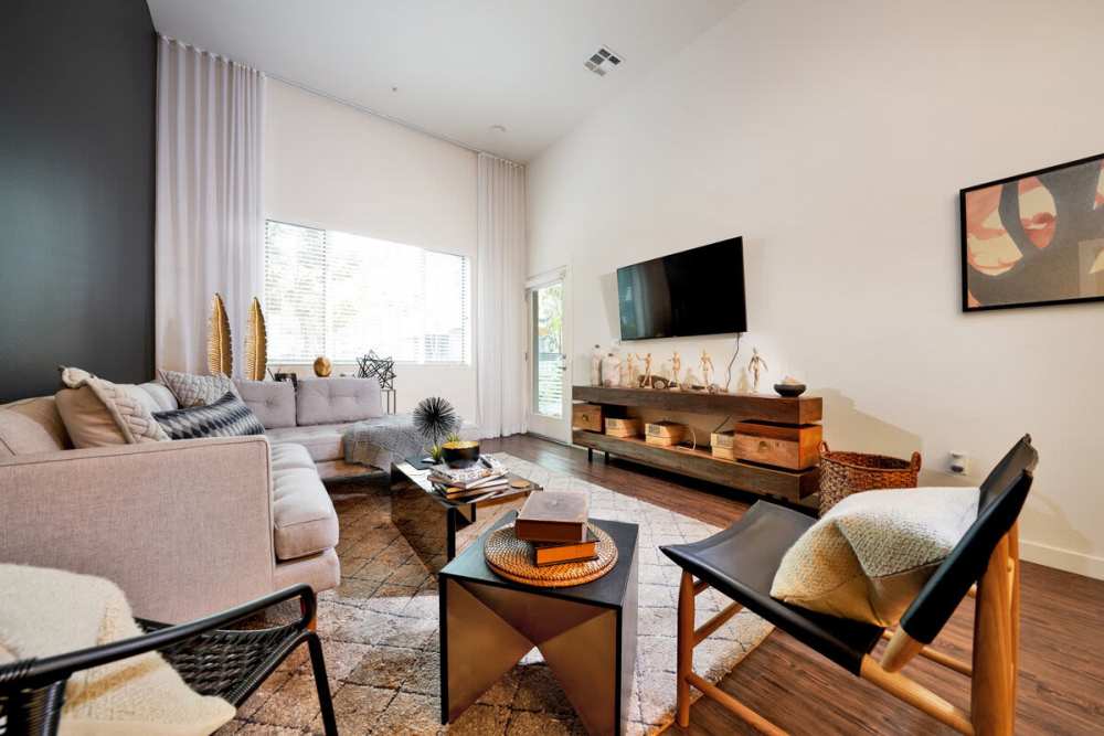 Living space with wood-style flooring at Nineteen01 in Santa Ana, California
