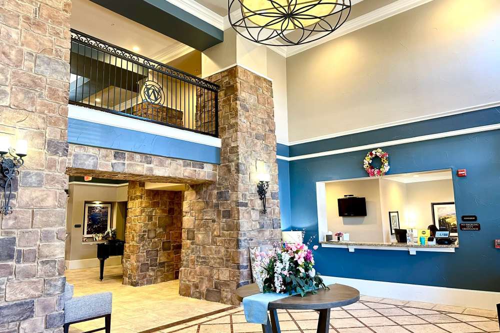 Front lobby with tile floors high ceilings and a welcoming reception desk