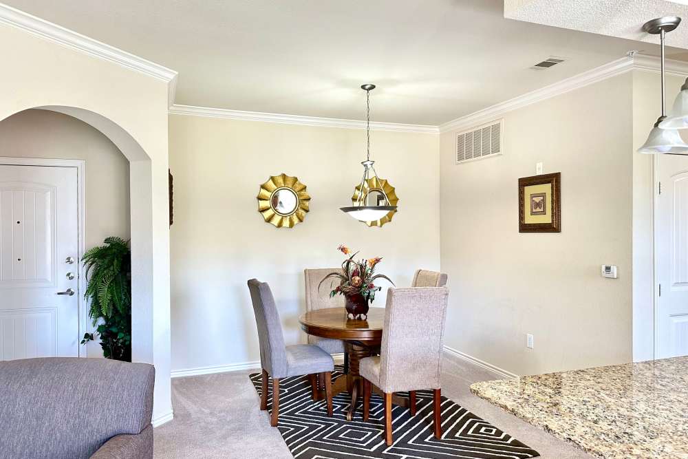 Charming dining area with a wooden table and comfortable chairs creating an inviting space for enjoying meals and gatherings