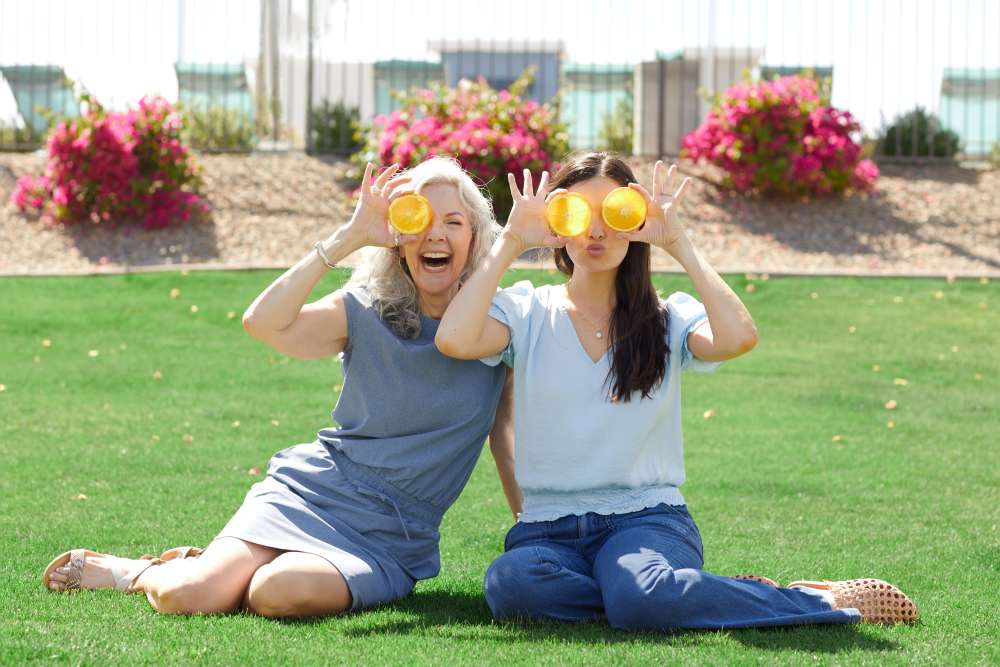 Woman and her mother having fun on the lawn at BB Living Wellen Park in Venice, Florida