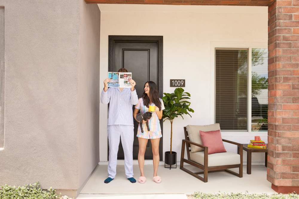 Couple with their pet on the patio at BB Living Wellen Park in Venice, Florida