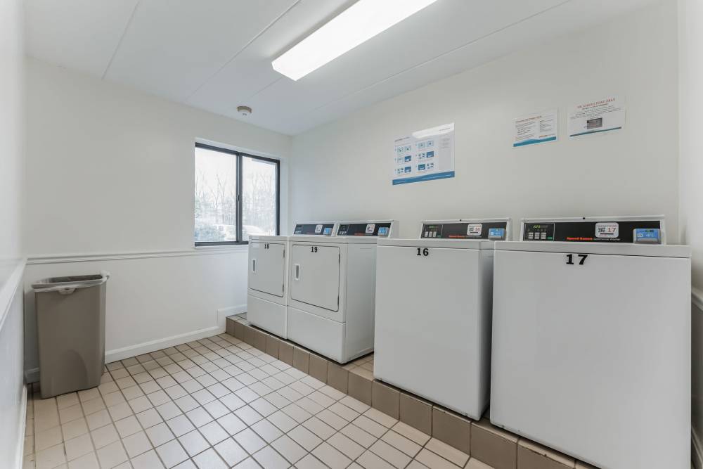 Functional laundry room at Eagle Rock Apartments at MetroWest in Framingham, Massachusetts