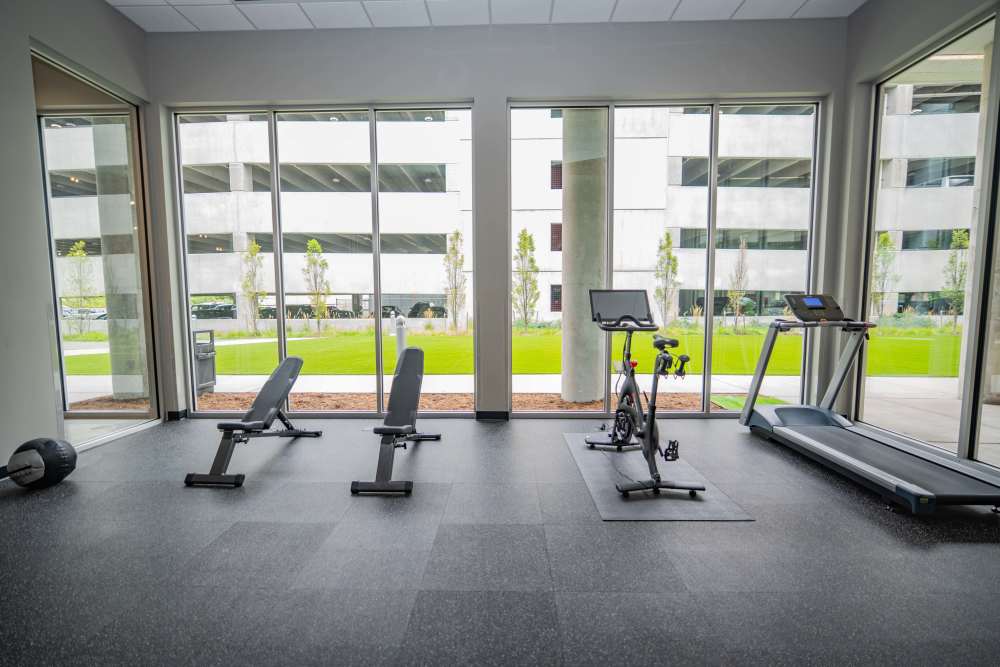 A gym room with treadmills and exercise equipment at Diamond Place I in Grand Rapids, Michigan