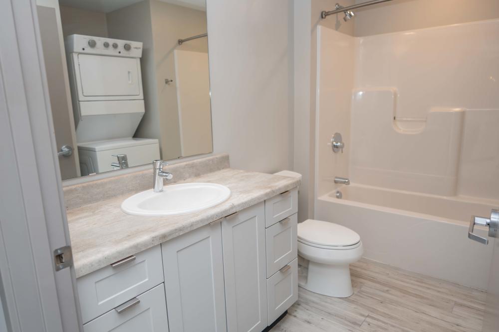 A bathroom with a white sink and toilet at Diamond Place I in Grand Rapids, Michigan