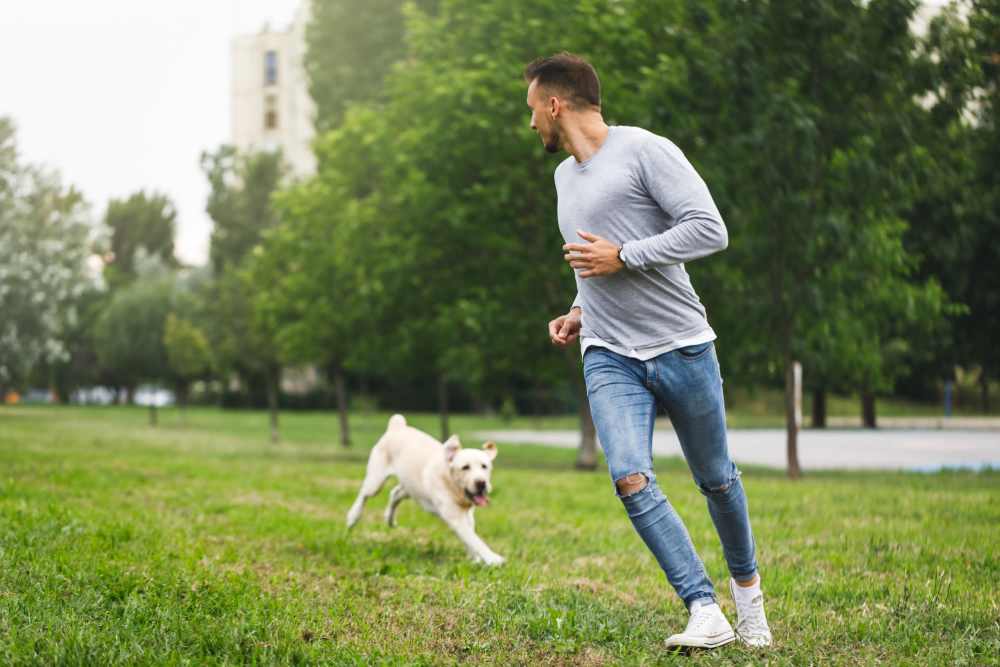 Resident playing with his dog at Oak Forest in Victoria, Texas